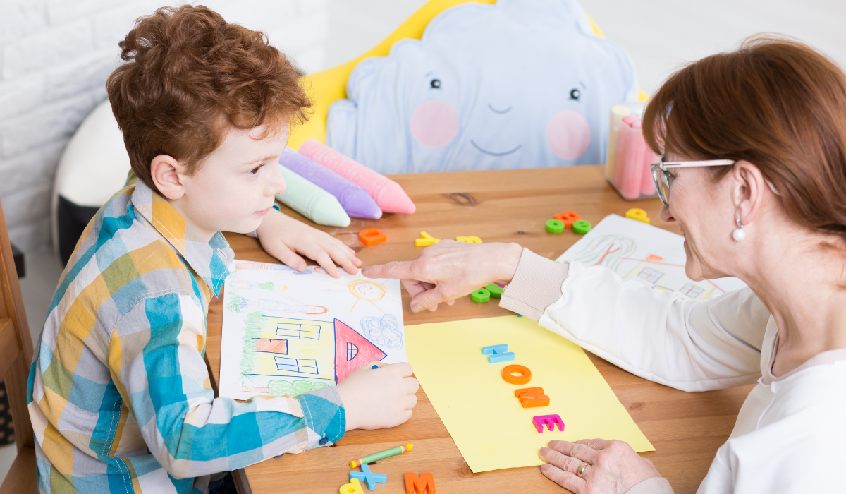 In-home ABA therapist working with a child and family in a community healthcare setting at home