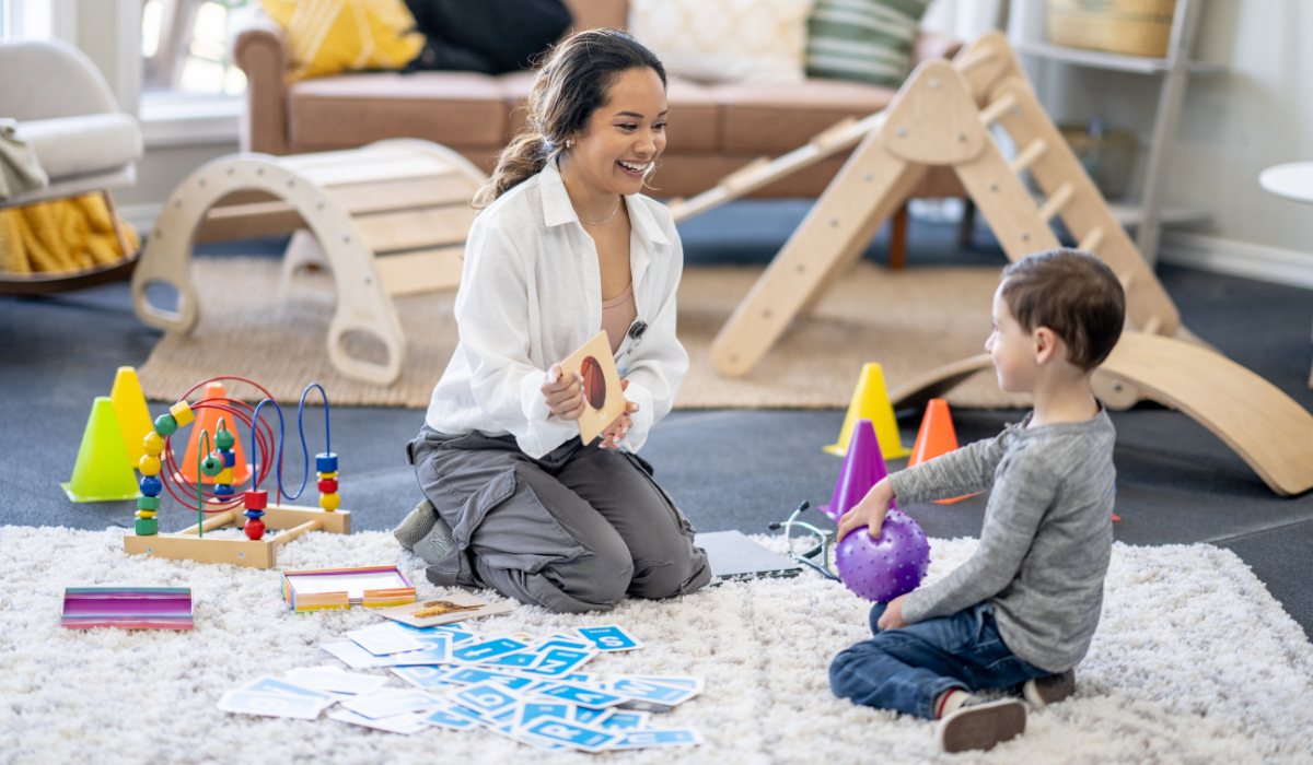 Child with autism practicing daily skills during in-home ABA therapy session with a trained therapist