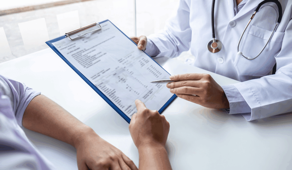 Doctor explaining LDL and HDL cholesterol levels to a patient at a free primary care clinic in Chicago