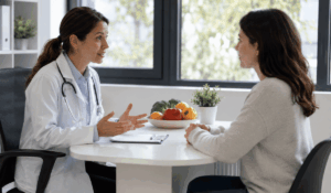 A doctor at IAMACF Free Health Clinic discussing natural GERD treatment options with a patient, fish