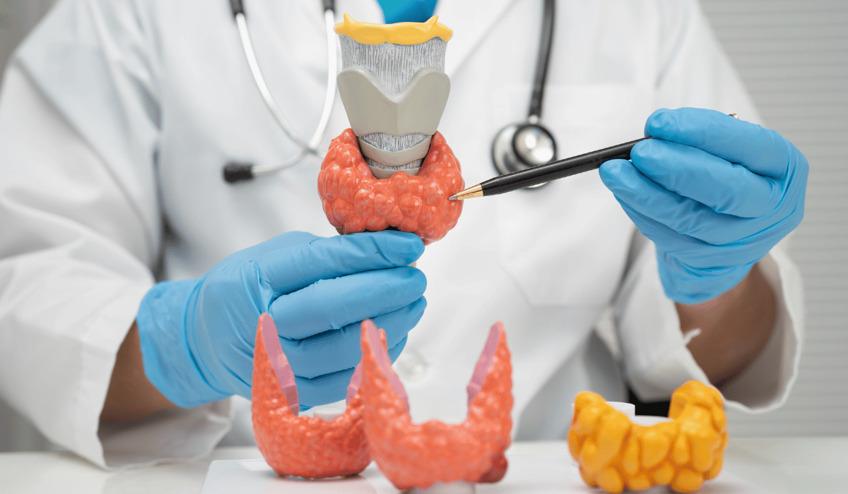Woman experiencing signs of hyperthyroidism like weight loss, anxiety, and rapid heartbeat